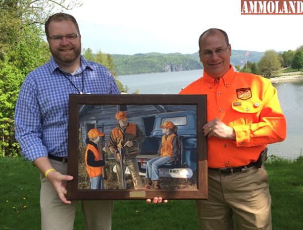 Jon Zinnel, Education Specialist for Federal Premium Ammunition (left) presents Rick Cerwick of Iowa (right) with the 2015 IHEA Instructor of the Year Award (art print).