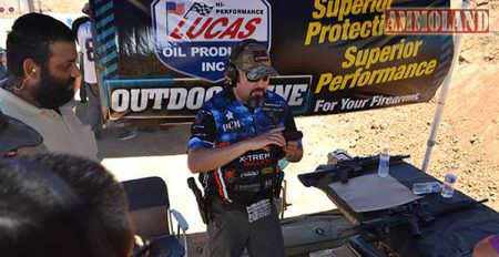 Lawrence Gurule, of Taran Tactical Innovations shooting team, offering free pistol instruction.
