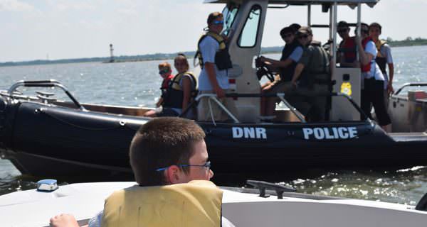 Fish & Wildlife Natural Resource Police Youth Academy students conduct a vessel boarding during training