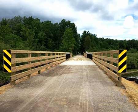 The North Western State Trail is 32 miles from M-119 in Petoskey to the trailhead in downtown Mackinaw City. The Carp Lake River Bridge replacement, shown here, was the last part of a recent trail improvement project.