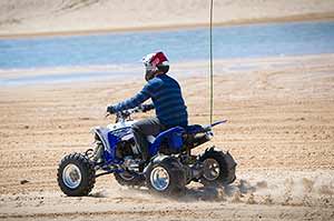  An off-road enthusiast rides the dunes along Lake Michigan's shoreline at Silver Lake State Park in Oceana County. The upcoming Free ORV Weekend Aug. 20-21 offers riders the chance to explore Michigan’s state-designated routes and trails, no permit needed.
