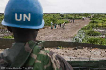 A U.N. peacekeeper stands guard at an outpost outside the United Nations Mission in South Sudan compound in Malakal, South Sudan, in July. (Jane Hahn/For The Washington Post)