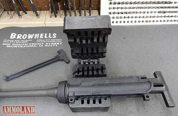 AR 15 Rifle Upper Receiver Placed in the Action Block, before removing an AR 15 A2 front sight. Figure 10: The AR15 Rifle upper receiver in the action block, ready to be closed and clamped in a vise before removing an AR 15 A2 front sight.