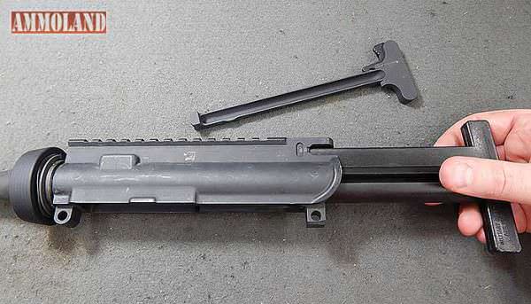 Figure 9: With the AR15 Rifle bolt carrier and charging handle removed and the receiver cleared of sights or optics, slide the action insert into the upper receiver.