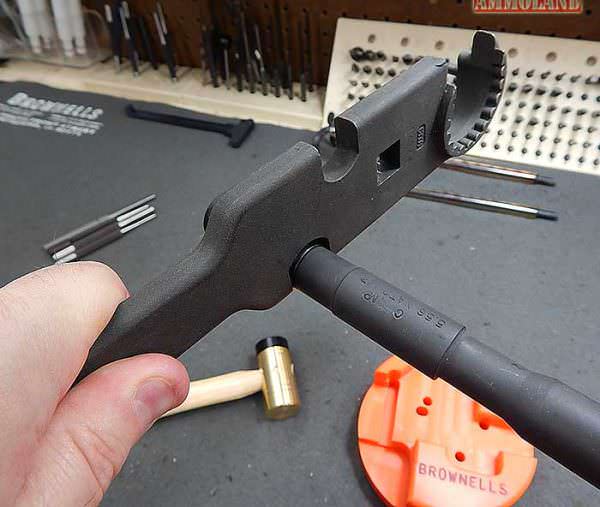 Figure 12: Once you've got your Ar15 Armors wrench firmly placed on the flash hider's flats, apply gradual and firm pressure to loosen the flash hider and unscrew it.