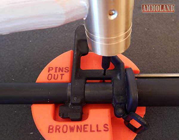 Driving out the AR 15 front sight gas tube roll pin.