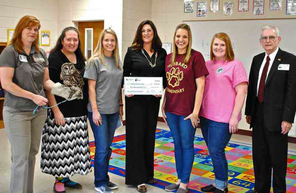 Tiffany Smith, a third-grade teacher at Samuel E. Hubbard Elementary in Monroe County, received the 2016 Conservation Teacher of the Year grant from DNR and TERN, friends group of DNR's Nongame Conservation Section. Pictured from left are Linda May, Nongame Conservation’s environmental outreach coordinator, Hubbard third-grade teachers Marnai Boose, Amy Carter, Smith (grant recipient), Katie Whitley and Lynn Grizzard, and TERN representative Ron Lee. While Smith submitted the award-winning proposal, all of the school's third-grade educators and students will work on the bog garden project. Credit: Anna Yellin/DNR