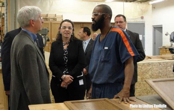 Heidi E. Washington with Gov. Rick Snyder