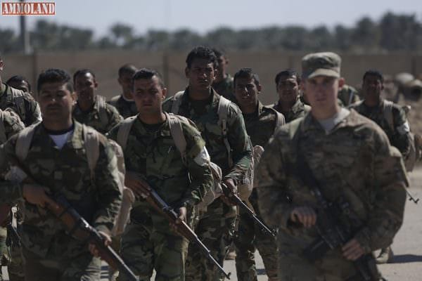 Iraqi soldiers enrolled in the Iraqi Ranger course conduct training. Iraqi soldiers enrolled in the Iraqi ranger course conduct a road march under the supervision of U.S. soldiers with 1st Battalion, 32nd Infantry Regiment at Camp Taji, Iraq, March 7, 2016. The Iraqi ranger course is an advanced infantry fighting school established to help train special operations soldiers for the Iraqi Army. Army photo by Sgt. Paul Sale