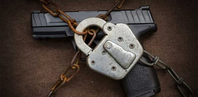 Locked Chained Gun Firearms Ban AdobeStock_95690334