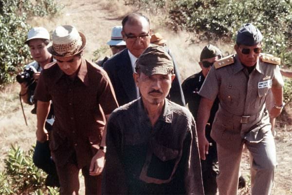 Japanese imperial army soldier Hiroo Onoda : This picture taken on March 11, 1974 shows former Japanese imperial army soldier Hiroo Onoda, center, walking from the jungle where he had hidden since World War II, on Lubang island in the Philippines.