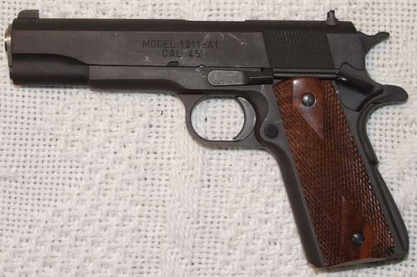 1911 handgun with traditional blued finish