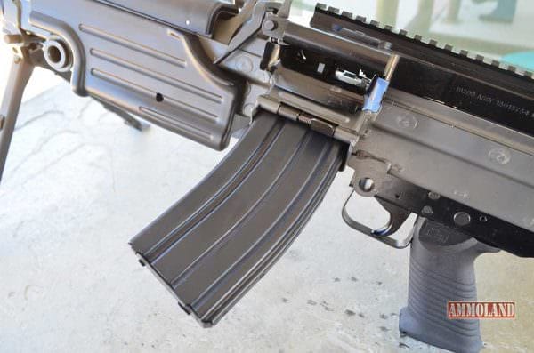 FNH M249S SAW Light Machine Gun Mag Well for M16 Magazines FNH M249S SAW Light Machine Gun Mag Well for M16 Magazines