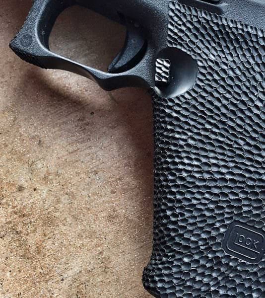 Glock 17 handgun with Custom Magazine Release Recess : Glock Handgun Stippling