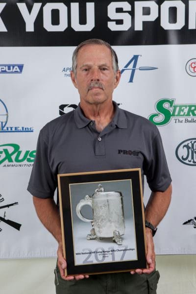 Norm Crawford holding the prestigious Wimbledon Cup award