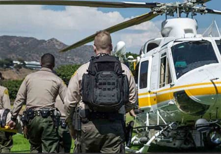 LASD officer carrying the Tiburon 3-Day Backpack loaded with tac-med gear during air operations training.