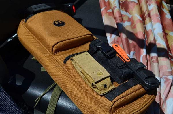 Ruger ships the Silent SR with a MOLLE compatible pouch that fits quite nicely on the Takedown 10/22 back pack