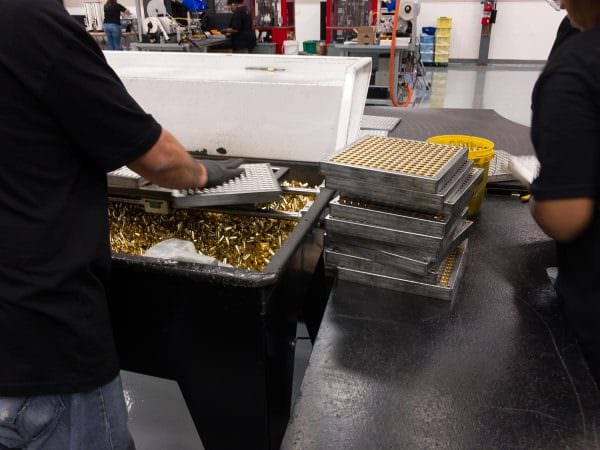 Sig Sauer's brass case "tray" loading system in action.