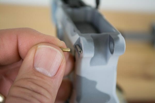 The pivot pin spring and detent are a bit of a pain to install. A tool makes it easier but you can do it the manual way using a small punch to hold the spring in place.