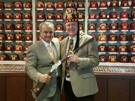 Anthony Imperato, President of Henry Repeating Arms (L) presenting Serial #1 of the Shriners Tribute Edition Rifle to Gary Bergenske, the Imperial Potentate of Shriners International (R).