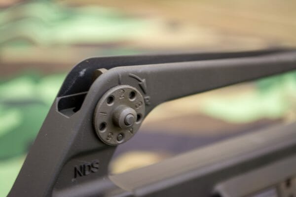 The A1 rear sight features a flip aperture to adjust for longer ranges.
