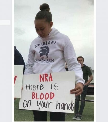 Student Holds Anti-NRA Sign in ΜΟΛΩΝ ΛΑΒΕ Hoodie