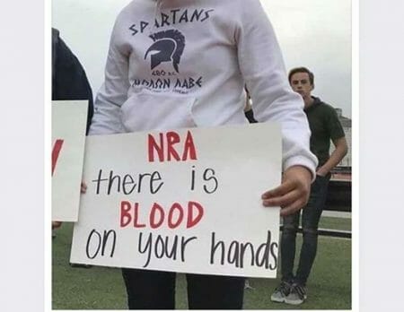 Student Holds Anti-NRA Sign in ΜΟΛΩΝ ΛΑΒΕ Hoodie