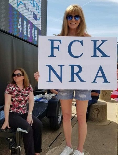 Proud NRA Protestor with Vulgar Sign