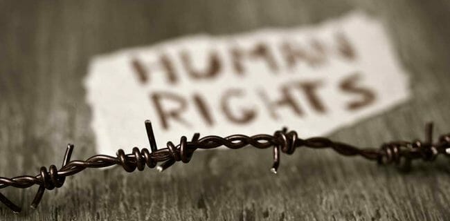 Human Rights Lawsuit barbed wire and text human rights AdobeStock_128873236