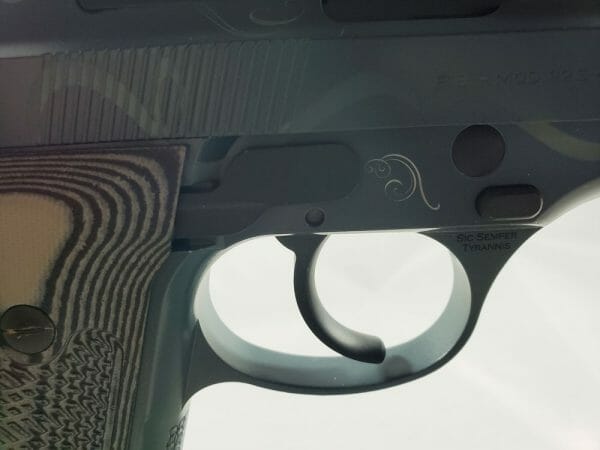 The swirl pattern on the Beretta 92s continues on the bottom of the frame and the trigger guard.