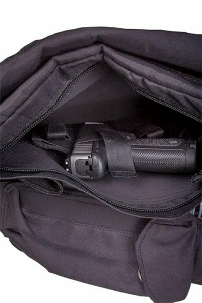 The hidden padded pocket that Man-PACK built into the bottom of the Spitfire XL allows the user to store a subcompact or a compact pistol in the bag.