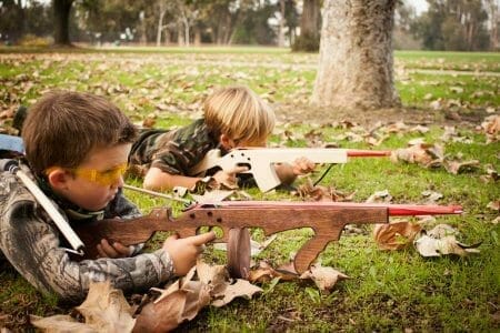 toy rubber band guns kids play playing cops robbers iStock 178989833