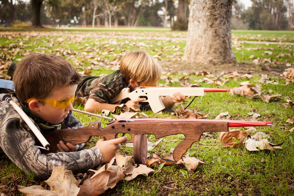 toy rubber band guns kids play playing cops robbers iStock 178989833