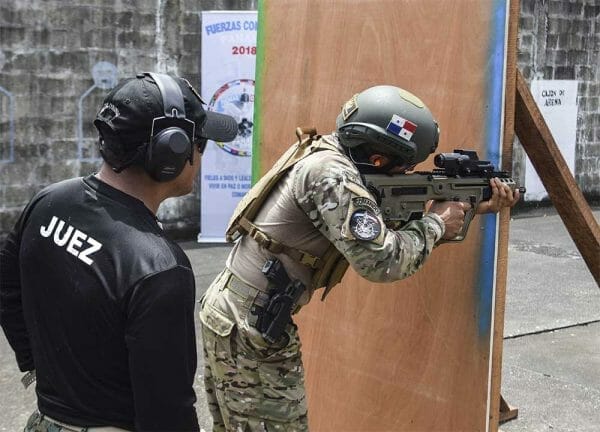 A Panamanian commando takes on an assault on a range during the Fuerzas Comando Competition at the Instituto Superior Policial, Panama, July 18, 2018. Army photo by Staff Sgt. Brian Ragin 