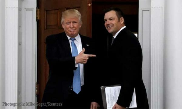 President Donald Trump and Kris Kobach Photograph: Mike Segar/Reuters 