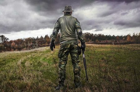 Camo Clad Hunter Gun Owner with Shotgun