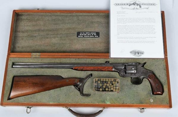 Smith & Wesson Model 320 revolving rifle shipped from factory in 1894, with case and box of scarce S&W .320 cartridges. Estimate: $8,000-$12,000