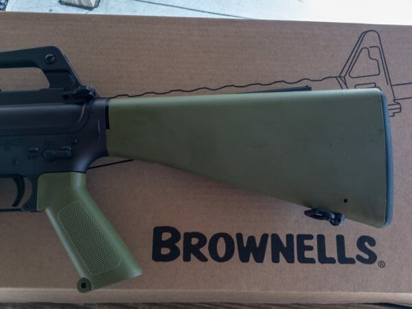 Brownells BRN-601 AR-15 Rifle. The fixed stock, pistol grip, and handguard are all olive drab.