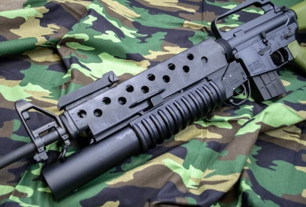 Here's the Lewis Machine & Tool (LMT) M203 37mm launcher installed on the Brownells BRN-601 AR-15 rifle.