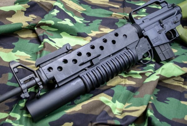 Here's the Lewis Machine & Tool (LMT) M203 37mm launcher installed on the Brownells BRN-601 AR-15 rifle. Here's the Lewis Machine & Tool (LMT) M203 37mm launcher installed on the Brownells BRN-601 AR-15 rifle.