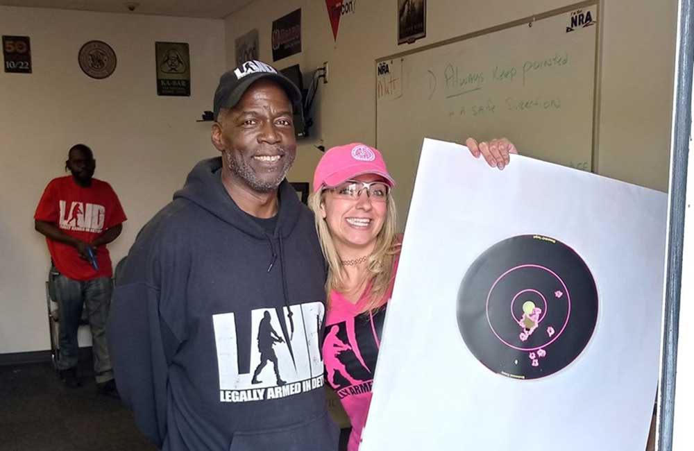 Rick Ector, a Detroit resident and founder of “Legally Armed In Detroit with student Thera Mayo
