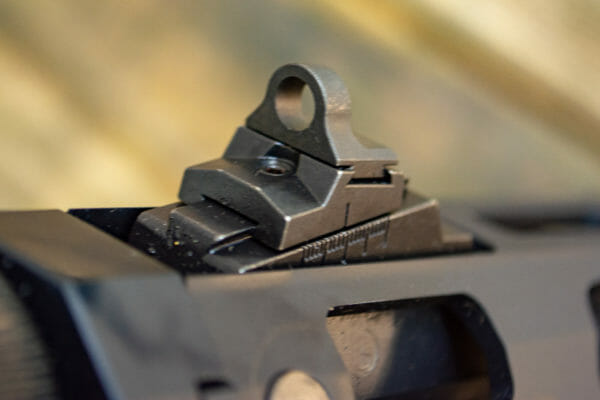 The PC Carbine comes with steel aperture sights, both mounted on the the forend. The rear is adjustable for windage and elevation. The PC Carbine comes with steel aperture sights, both mounted on the the forend. The rear is adjustable for windage and elevation.