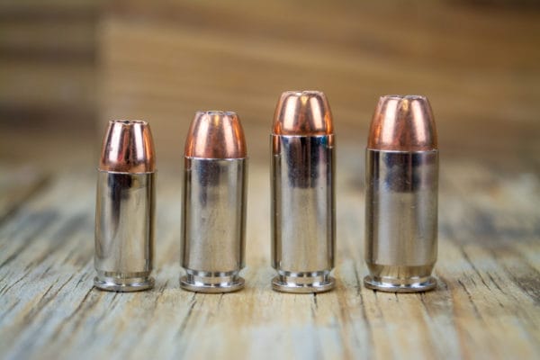 A family of Sig Sauer V-Crowns, left to right: 9mm 124-grain, .40 S&W 180-grain, 10mm 180-grain, .45 ACP 230-grain.