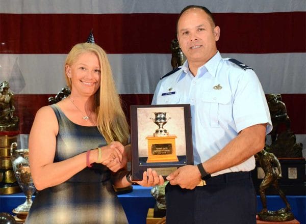 Sara Rozanski receives the Women's Trophy NTI winner's plaque, presented by Col. Michael A. Hrynciw, Ohio Air National Guard Red Horse Squadron at the National Trophy awards ceremony at Camp Perry.