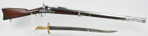 Near-mint unissued Whitney Model 1861 US Navy rifle, barrel dated 1863, .69 caliber, large eagle-and-flag motif on lock. Bayonet made by Collins & Co. (Hartford, Conn.). Estimate: $6,000-$8,000