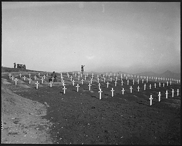 Marines of the 1st Marine Division pay their respects to fallen comrades during memorial services at the division's cemetery at Hamhung, North Korea, following the breakout from Chosin Reservoir.