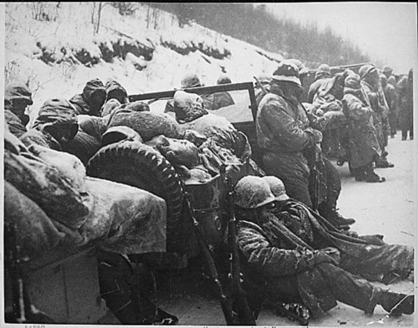 Marines of the 5th and 7th regiments who hurled back a surprise onslaught by three Chinese divisions wait to withdraw from the Chosin Reservoir area in North Korea, in December 1950.