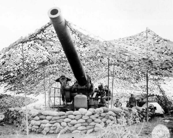 Army soldiers of Battery B, 697th Field Artillery Battalion, prepare to fire a 240 mm howitzer into German-held territory near Mignano, Italy, Jan. 30, 1944.