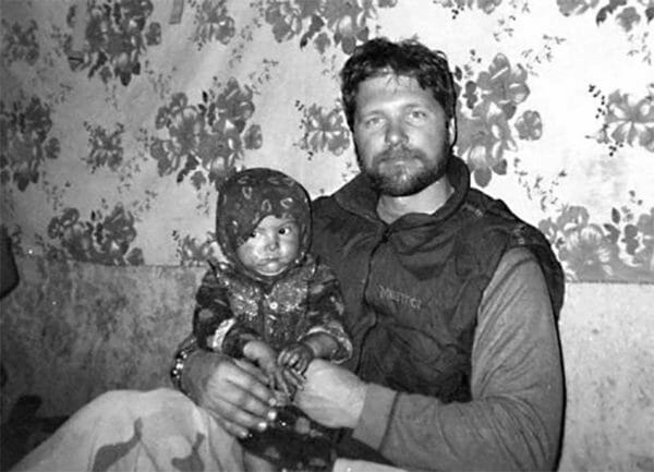 Fallen Air Force Combat Controller Tech. Sgt. John A. Chapman poses with a child during deployment. Courtesy photo