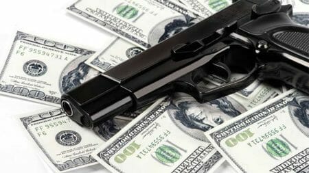 Guns-and-Money-NRA-ILA-iStock -LarisaBozhikova - 515708952